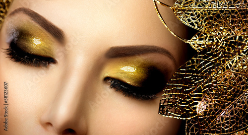Fashion Glamour Makeup. Holiday Gold Glittering Eyeshadows