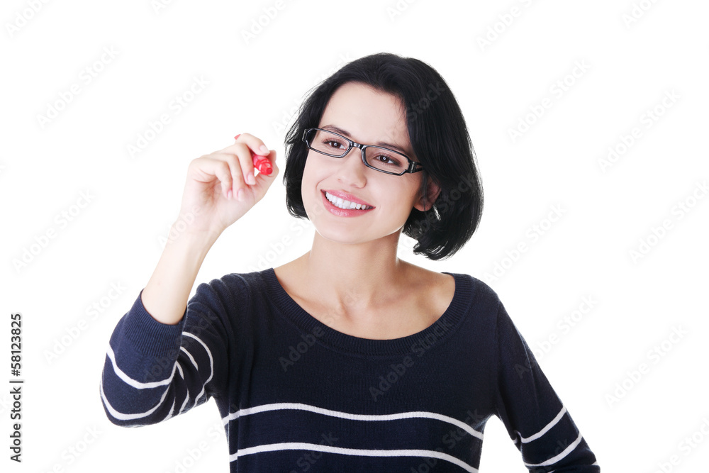 Attractive woman with pen trying to write on copy space. Attractive woman with pen trying to write on copy space.