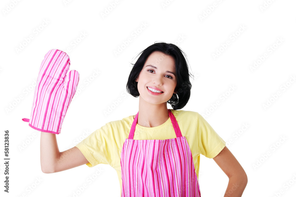 Young housewife in kitchen apron and kitchen glove. Young housewife in kitchen apron and kitchen glove.