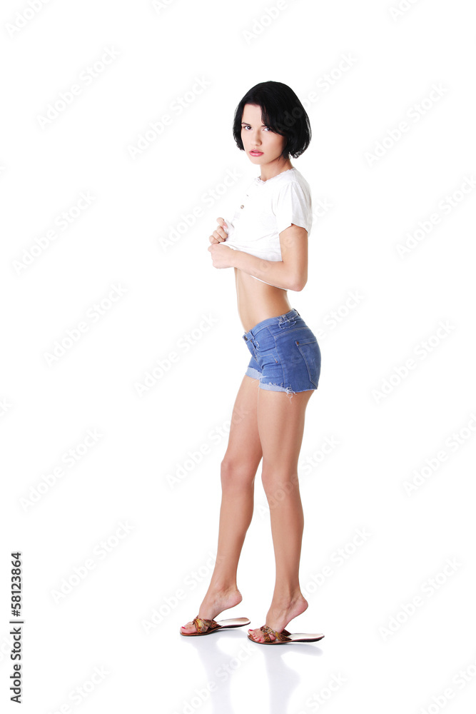 young attractive woman in shorts and tshirt. young attractive woman in shorts and tshirt.