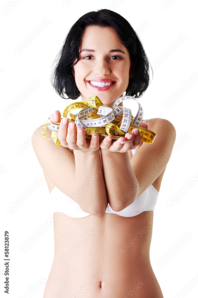 Attractive woman in bra with measuring tapes. Attractive woman in bra with measuring tapes.