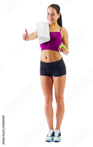 Young sporty girl with towel and apple