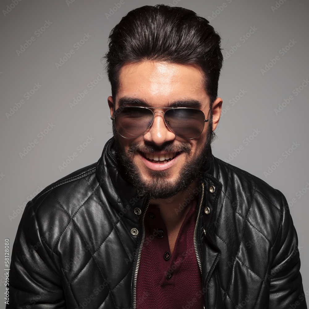 man with long beard smiling to the camera man with long beard smiling to the camera