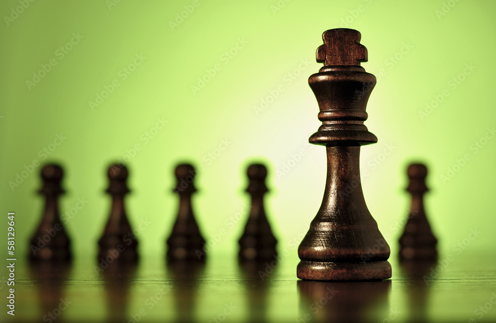 King chess piece with pawns