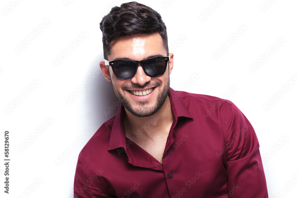 casual man looks at you and smiles casual man looks at you and smiles