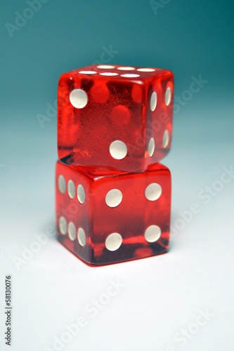 Two Red Dice on top of another photo