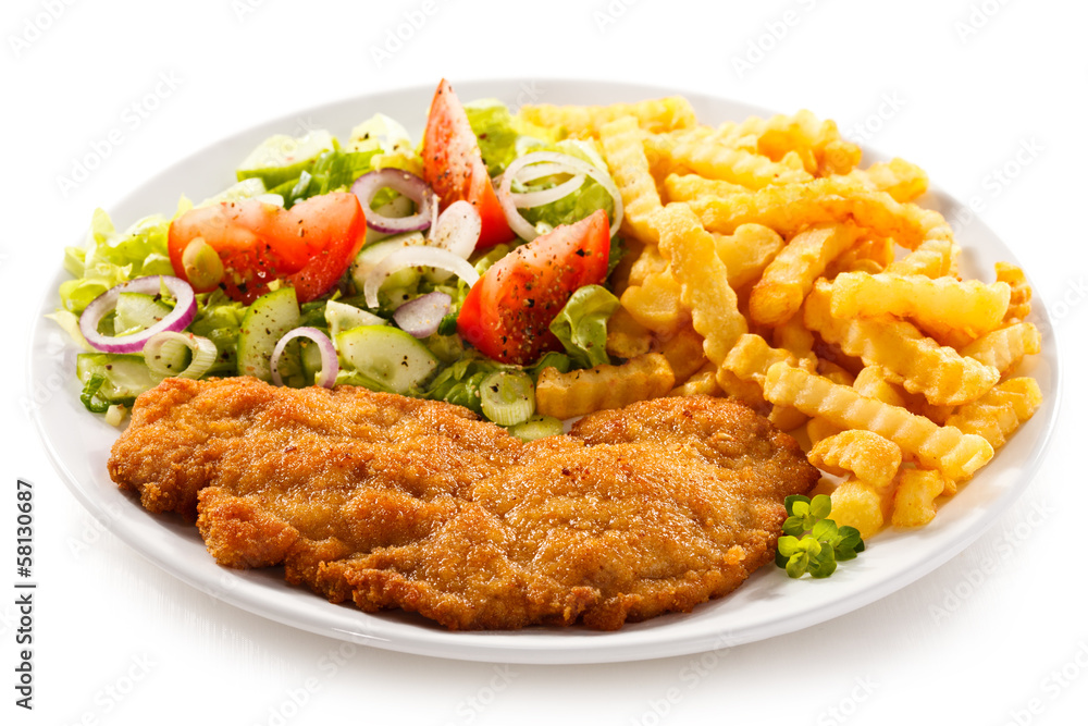 Pork chop, French fries and vegetables Pork chop, French fries and vegetables