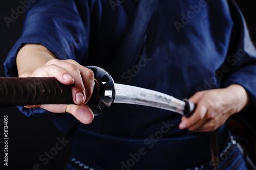 Kendo fighter with sword detail photo