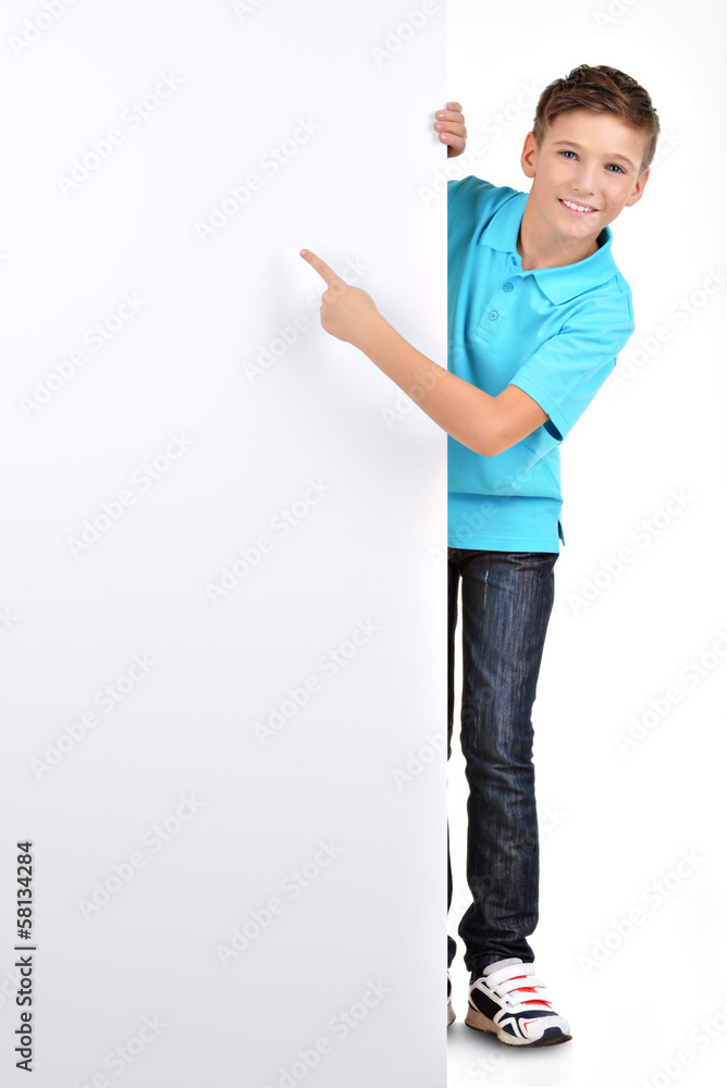 Full portrait of boy pointing on white banner Full portrait of boy pointing on white banner