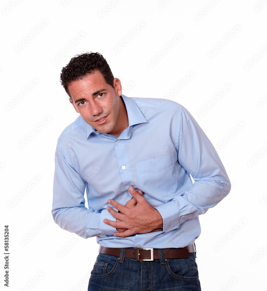 Handsome hispanic guy with stomach pain Handsome hispanic guy with stomach pain