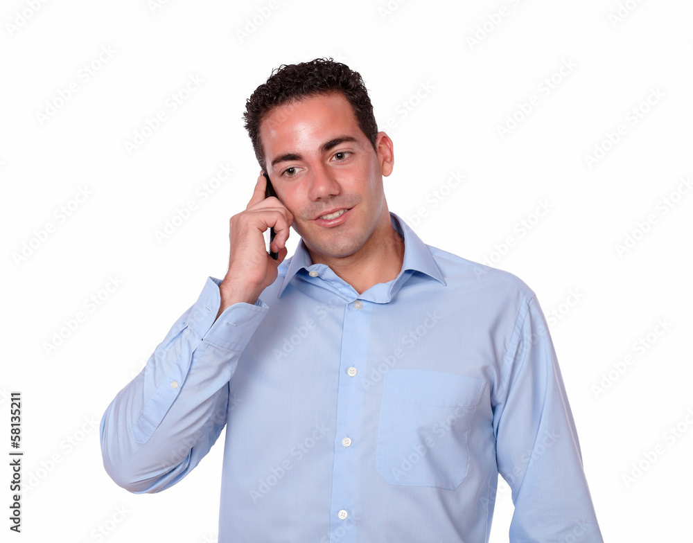 Attractive young man talking on his cellphone Attractive young man talking on his cellphone