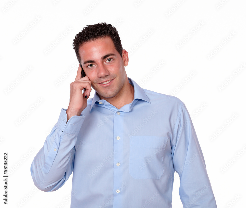 Adult hispanic man talking on his mobile Adult hispanic man talking on his mobile