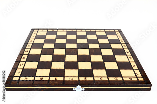 Fotografering The chessboard on the white background