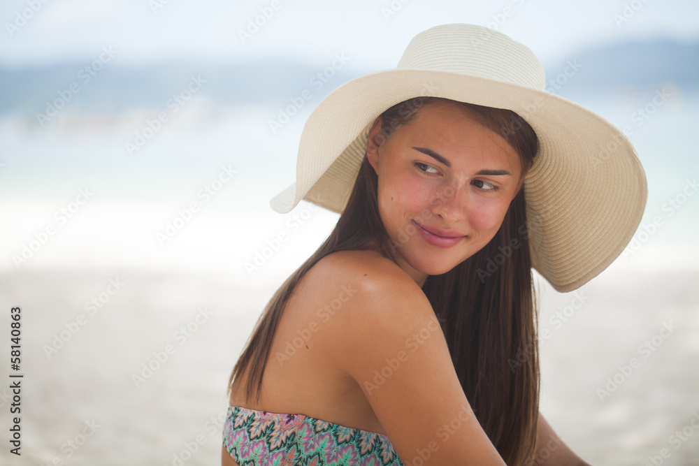 Young beautiful woman on the beach