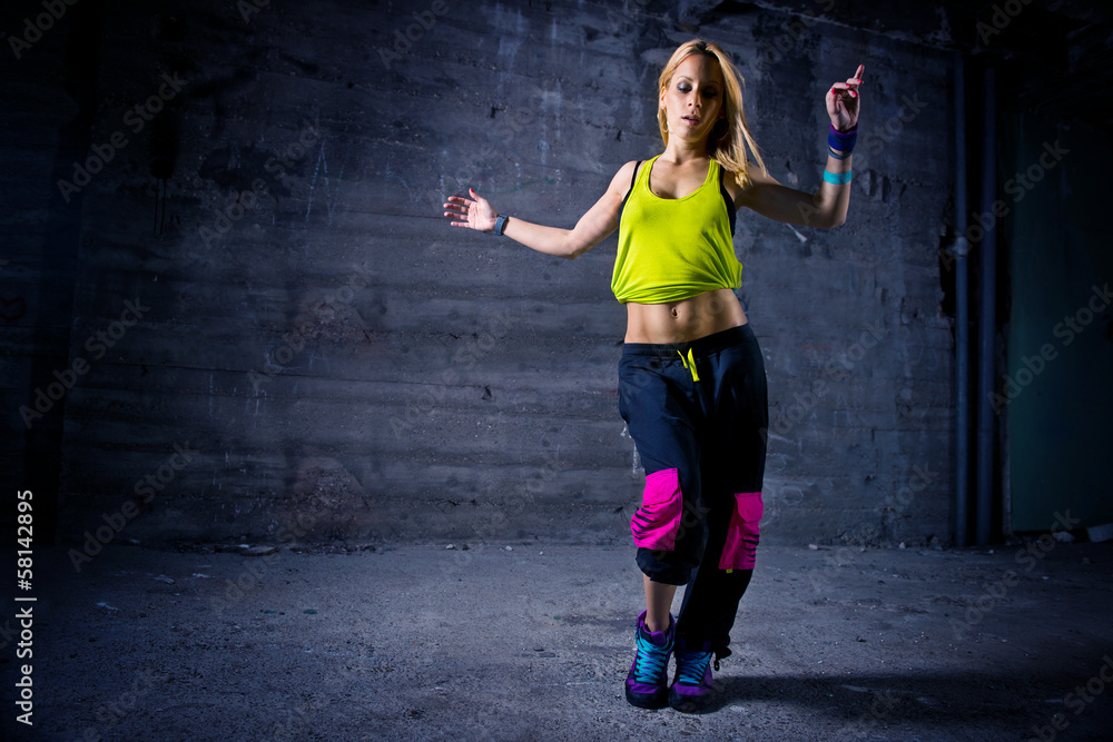 Woman dancing in urban environment Woman dancing in urban environment