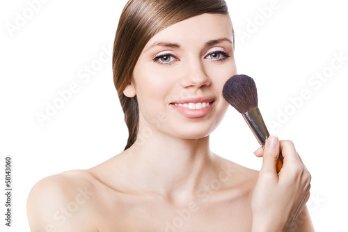 natural smiling woman and brush on cheek