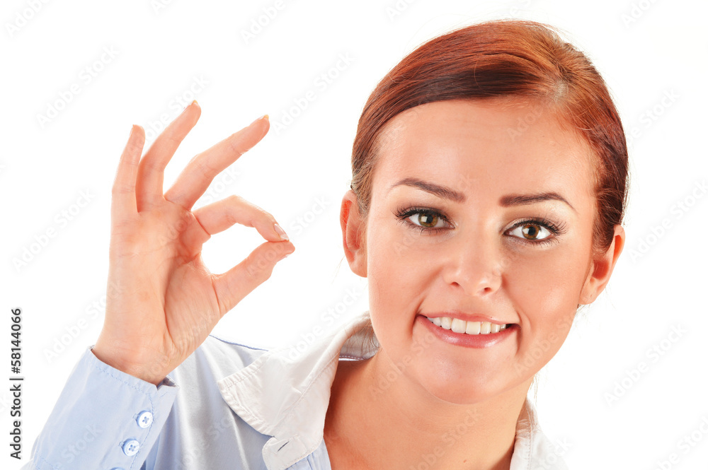 Young woman showing ok gesture isolated on white Young woman showing ok gesture isolated on white