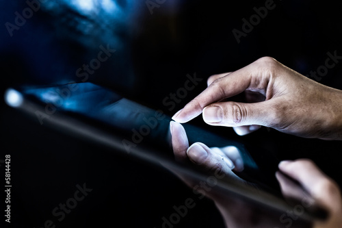 Woman holding digital tablet  closeup