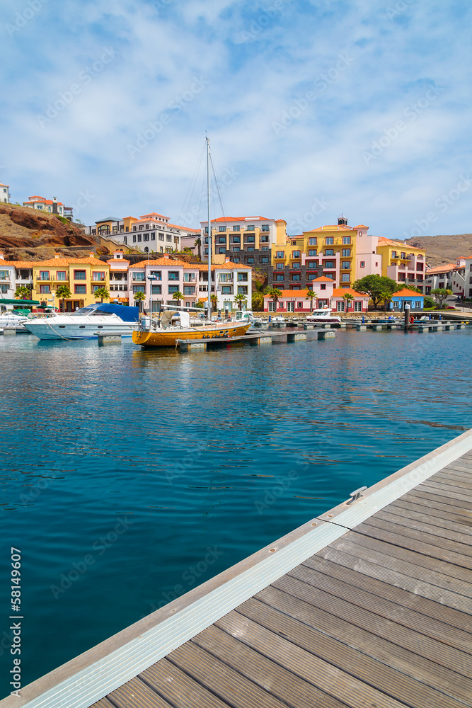 Wooden pier in marina with yacht boats mooring on Madeira island