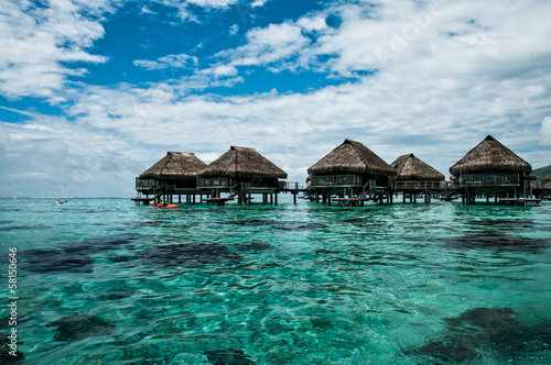Fototapeta Naklejka Na Ścianę i Meble -  Overwater bungalows inside a lagoon of Moorea in polynesia