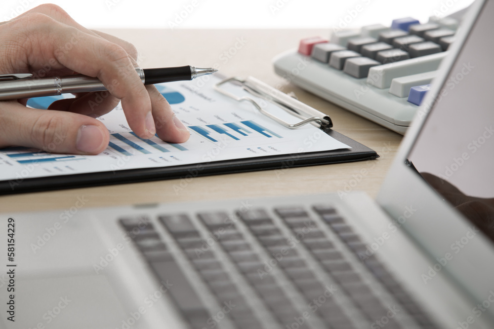 Businessman analyzing investment charts Businessman analyzing investment charts