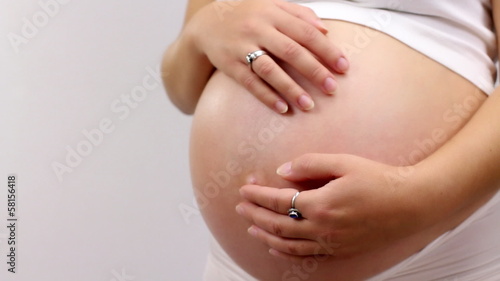 Wallpaper Mural Pregnant woman showing a heart on her hands Torontodigital.ca