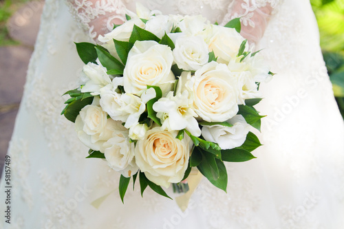 A bouquet of white roses. The bride, a wedding, a holiday. white