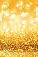 golden glitter and stars for christmas background vertical