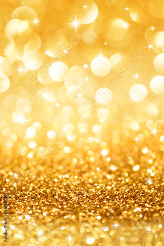 golden glitter and stars for christmas background vertical