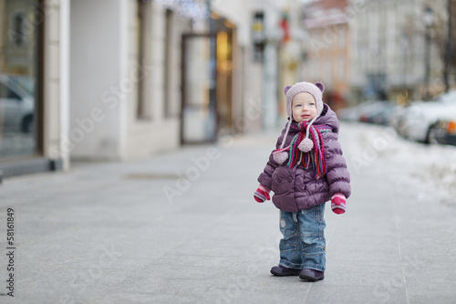 Little girl having fun on winter day