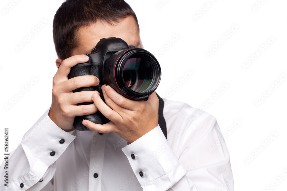 Young man taking photo with professional camera Young man taking photo with professional camera