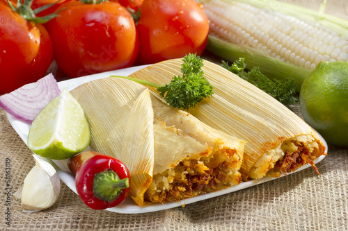 Mexican tamales on plate.