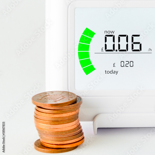 House energy meter showing the cost per hour for electricity usa photo