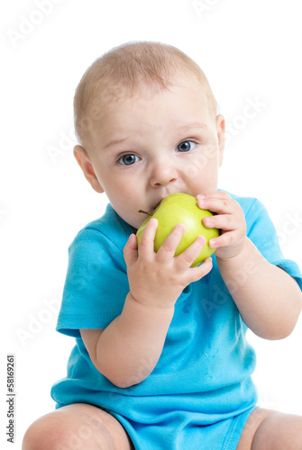 baby boy eating green apple