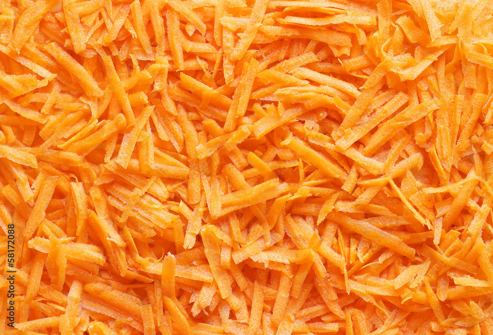 Grated carrot close-up, for backgrounds or textures. Grated carrot close-up, for backgrounds or textures.