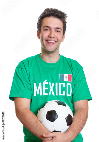 Laughing mexican football fan with ball