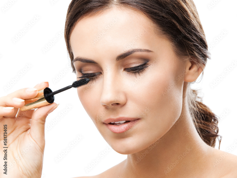 Young woman with cosmetics brush, isolated