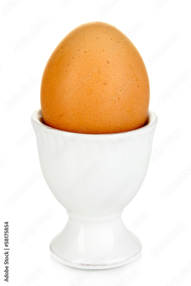 Whole boiled egg in egg cup isolated on white Whole boiled egg in egg cup isolated on white