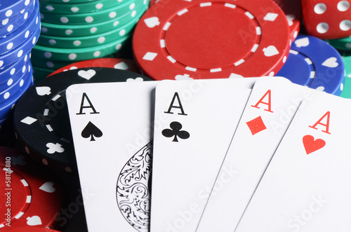 Four ases and casino chips photo