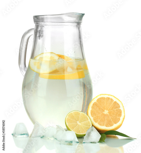 Cold water with lime, lemon and ice in pitcher isolated on