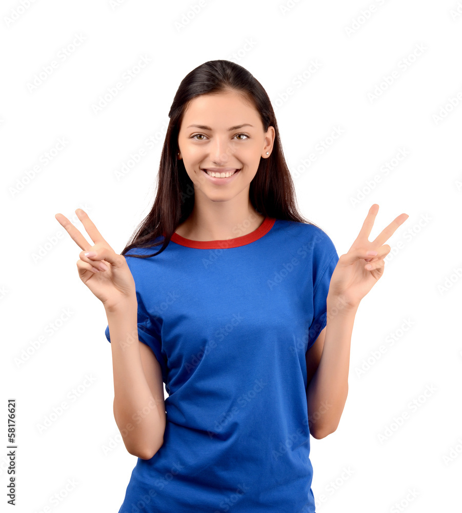 Happy girl with blue t-shirt signing victory. Happy girl with blue t-shirt signing victory.