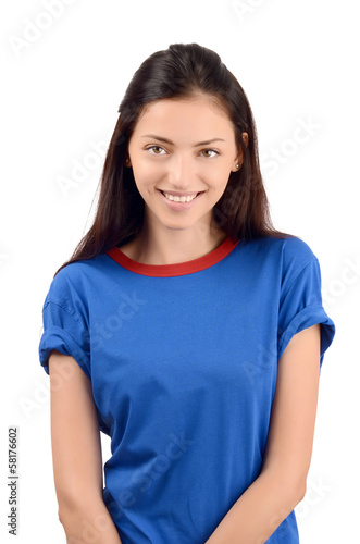 Portrait of a beautiful girl smiling wearing a blue t-shirt. © luanateutzi