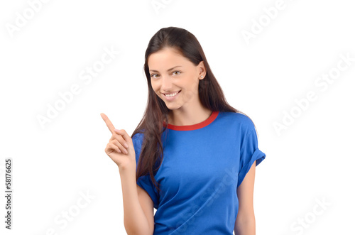 Attractive girl with blue t-shirt pointing up..