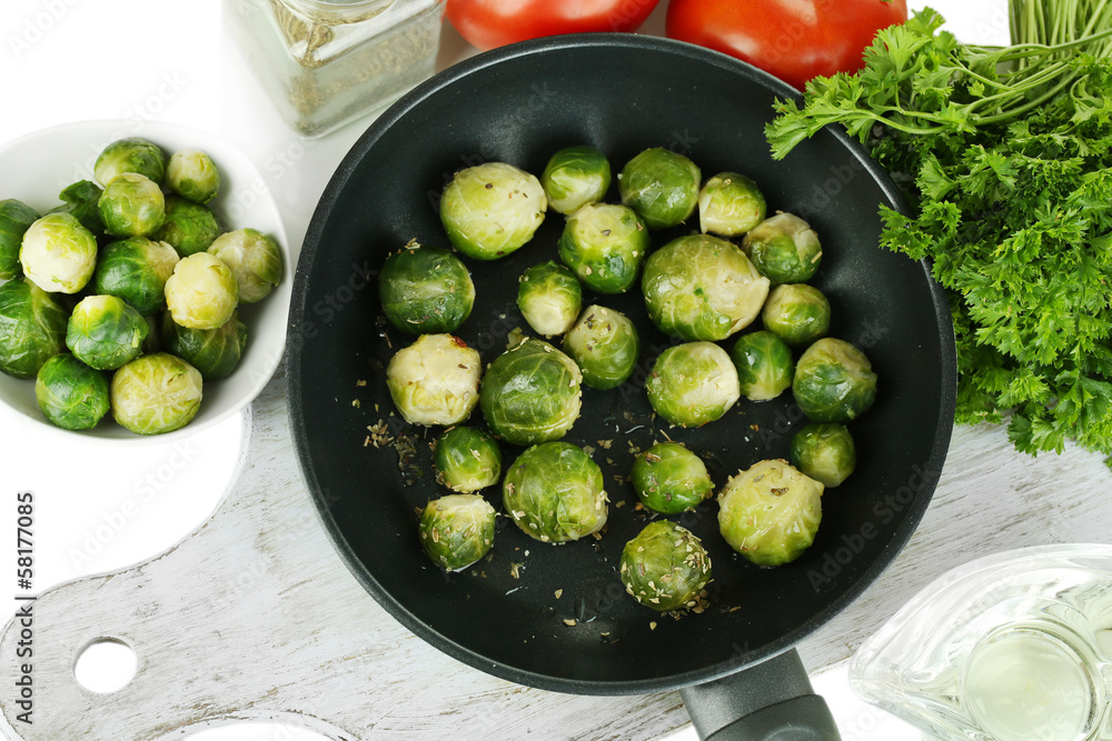 Fresh brussels sprouts in pan with vegetables and spices Fresh brussels sprouts in pan with vegetables and spices