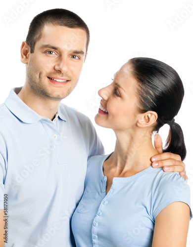 Portrait of young happy smiling attractive couple, isolated on w