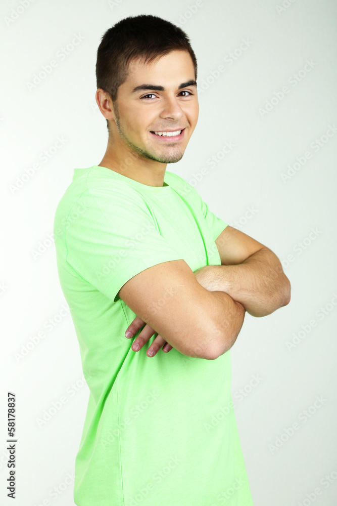 Portrait of young man on grey background Portrait of young man on grey background