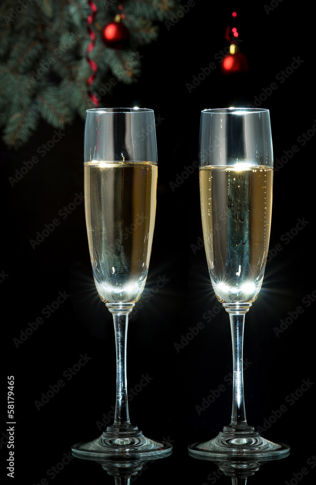 Flutes of champagne in holiday setting. Closeup. Flutes of champagne in holiday setting. Closeup.