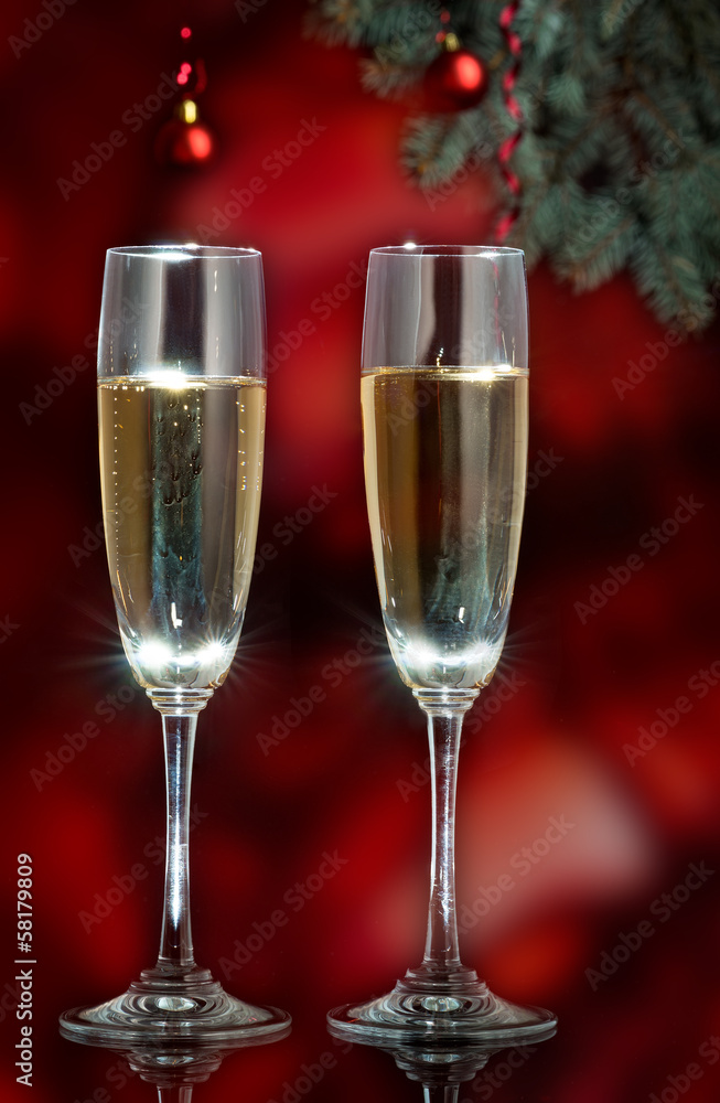Flutes of champagne in holiday setting. Closeup. Flutes of champagne in holiday setting. Closeup.