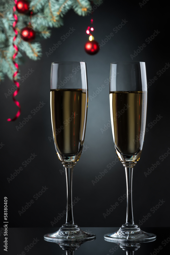 Flutes of champagne in holiday setting. Closeup. Flutes of champagne in holiday setting. Closeup.