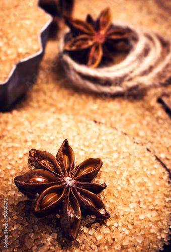 Cinnamon sticks and star anise on brown sugar macro. Christmas s